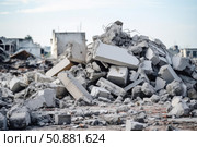Pile of concrete debris dominating post disaster landscape. Стоковое AI-изображение, AI-художник Иван Рябоконь / Фотобанк Лори