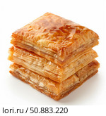 Stack of delicious golden brown phyllo dough pastries isolated on white. Стоковое AI-изображение, AI-художник Иван Рябоконь / Фотобанк Лори
