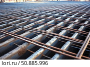 Reinforcing steel bars forming grid structure for concrete reinforcement on construction site. Стоковое AI-изображение, AI-художник Иван Рябоконь / Фотобанк Лори