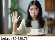 Young woman refusing cheese showing stop sign with hand. Стоковое AI-изображение, AI-художник Иван Рябоконь / Фотобанк Лори
