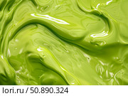 Wavy light green glossy paint flowing creating abstract shapes. Стоковое AI-изображение, AI-художник Иван Рябоконь / Фотобанк Лори