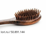 Wooden brush resting on white surface with bristles pointing upward. Стоковое AI-изображение, AI-художник Иван Рябоконь / Фотобанк Лори