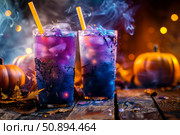 Spooky halloween cocktails releasing smoke with pumpkins and dry ice on rustic wood table. Стоковое AI-изображение, AI-художник Иван Рябоконь / Фотобанк Лори