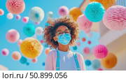 Hopeful youth with curly hair and spectacles, wearing a light blue protective face covering, surrounded by a whimsical array of buoyant, brightly hued spheres under an azure sky. Стоковое AI-видео, аниматор Данила Большаков / Фотобанк Лори