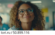 A charming woman with a radiant smile and curly brown hair, wearing tortoiseshell spectacles, looks upwards in a brightly lit environment. Стоковое AI-видео, аниматор Данила Большаков / Фотобанк Лори