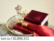 The Christian cross lies on top of the book of the Bible. Стоковое фото, фотограф Наталия Кирсанова / Фотобанк Лори