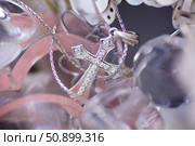 Christian cross to wear on the body after baptism. Стоковое фото, фотограф Наталия Кирсанова / Фотобанк Лори