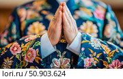 Concept: Respectful hands gesture. Purpose: Illustration for meditation practices, or a traditional ceremony, where the embroidered garment is a main subject. Стоковое AI-изображение, AI-художник Данила Большаков / Фотобанк Лори