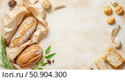 Culinary composition featuring various baked goods and fresh spices on a beige surface. Стоковое AI-изображение, AI-художник Данила Большаков / Фотобанк Лори