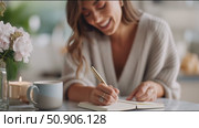 Writing a journal entry in a cozy space with a warm beverage and fresh flowers in the background. Стоковое AI-видео, аниматор Сергей Толмачёв / Фотобанк Лори