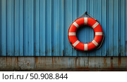 Life Preserver on a Bright Blue Wall at a Waterfront Location in Warm Sunlight. Стоковое AI-изображение, AI-художник Юлия Гапеенко / Фотобанк Лори