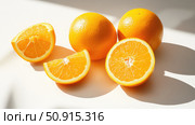 citrus oranges on white ai generated. Стоковое AI-изображение, AI-художник Vectorwin / Фотобанк Лори