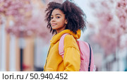 Portrait of a Girl Ready for School with Pink Backpack and Yellow Fleece. Стоковое AI-изображение, AI-художник Данила Большаков / Фотобанк Лори