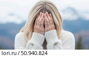 Concept: Emotional distress, portraying a woman covering her face with her hands, expressing sadness or anxiety. Стоковое AI-изображение, AI-художник Данила Большаков / Фотобанк Лори
