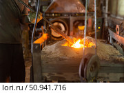 Ferrous metal billet is melted in an induction furnace closeup. Стоковое фото, фотограф Татьяна Яцевич / Фотобанк Лори