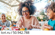 Intergenerational art: A family enjoys painting together, creating art and memories in a bright, cheerful space. Стоковое AI-изображение, AI-художник Данила Большаков / Фотобанк Лори