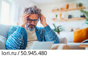 Concept: Man with a Headache; Purpose: Illustration of health issues, stress management. Стоковое AI-изображение, AI-художник Данила Большаков / Фотобанк Лори