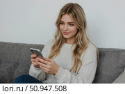 Phone scammers. A young woman is talking on her smartphone with scammers. Стоковое AI-изображение, AI-художник Александр Поташев / Фотобанк Лори