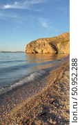 Vertical video of beautiful Baikal Lake at sunset light. Olkhon Island. Deserted sandy beach with steep cliffs along shore of Small Sea with blue pure transparent water in July evening. Natural background. Стоковое видео, видеограф Виктория Катьянова / Фотобанк Лори