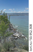 Vertical video of summer coast of Baikal Lake. View of Small Sea and rocky shore of Olkhon Island on July sunny day. Natural background. Summer travels and outdoors. Стоковое видео, видеограф Виктория Катьянова / Фотобанк Лори