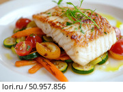 Grilled white fish fillet served with roasted vegetables, fresh herbs, and golden crust. Healthy gourmet dish, fine dining plating, appetizing close-up with rich colors and perfect lighting. Banner. Стоковое AI-изображение, AI-художник Евгений Демидюк / Фотобанк Лори