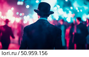 A dapper gentleman in a classic hat standing amidst a vibrant neon-lit crowd, observing the glowing atmosphere of a lively evening event. Стоковое AI-изображение, AI-художник Данила Большаков / Фотобанк Лори