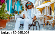 A joyful young individual with dreadlocks in a wheelchair, smiling brightly on a vibrant sunlit street, promoting accessible, inclusive travel. Стоковое AI-изображение, AI-художник Данила Большаков / Фотобанк Лори