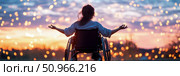 Freedom and Hope: Silhouette of a Woman in a Wheelchair Reaching for Bokeh Lights at Sunset, Celebrating Accessibility and Resilience. Стоковое AI-изображение, AI-художник Данила Большаков / Фотобанк Лори