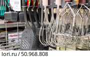 A rack of kitchen utensils including a spatula, whisk, and other items. Russia. Moscow. 02.08.25. Редакционное фото, фотограф Ярославский Максим / Фотобанк Лори