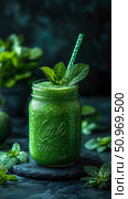 Refreshing and healthy vibrant green detox smoothie in a classic mason jar, garnished with fresh mint leaves and a festive straw on a dark slate background, promoting wellness and natural goodness. Стоковое AI-изображение, AI-художник Данила Большаков / Фотобанк Лори