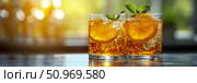 Two vibrant orange and mint summer cocktails, sparkling with bubbles and ice, set on a dark surface against a bright, sun-drenched background, evoking refreshing moments. Стоковое AI-изображение, AI-художник Данила Большаков / Фотобанк Лори