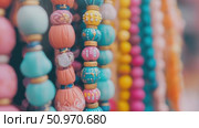 A captivating array of vibrant decorative beads showcasing intricate patterns and a rich palette of pastel hues. Стоковое AI-видео, аниматор Данила Большаков / Фотобанк Лори