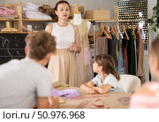 Woman teacher at blackboard conducts theoretical lesson for sewing school children students. Стоковое фото, фотограф Яков Филимонов / Фотобанк Лори
