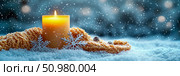 Winter Solstice: Illuminated Candle, Knitwear, and Snowflakes in a Snowy Scene. Стоковое AI-изображение, AI-художник Данила Большаков / Фотобанк Лори