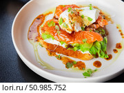 Delicious Gourmet Open-Faced Sandwich With Smoked Salmon and Poached Egg. Стоковое фото, фотограф EugeneSergeev / Фотобанк Лори