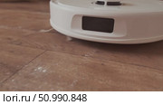 Robot cleans the floor freeing up your day for rest and relaxation with smart and efficient home cleaning technology. Стоковое видео, видеограф Svetlana Golovco / Фотобанк Лори