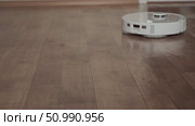 Robot washes the floor without intervention modern solution for effortless and efficient home cleaning every day. Стоковое видео, видеограф Svetlana Golovco / Фотобанк Лори