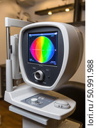 Automated perimeter showing colorful visual field test results in ophthalmology clinic. Стоковое фото, фотограф Юрий Поздников / Фотобанк Лори