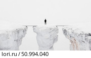 Solitary Figure on a Minimalist Bridge Spanning a Chasm in a White Landscape. Стоковое AI-изображение, AI-художник Данила Большаков / Фотобанк Лори