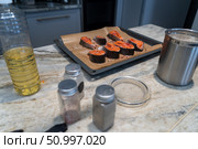 Preparation of fresh salmon steak cooking, ready to be baked, home made culinary experience. Стоковое фото, фотограф Данила Большаков / Фотобанк Лори