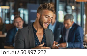 Young man speaks confidently in a stylish venue during a networking event among professionals. Стоковое AI-видео, аниматор Сергей Толмачёв / Фотобанк Лори