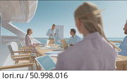 Business meeting on a yacht with a diverse group discussing strategies in a bright, sunny setting. Стоковое AI-видео, аниматор Сергей Толмачёв / Фотобанк Лори