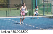 Young woman playing paddle tennis against team of women. Стоковое видео, видеограф Яков Филимонов / Фотобанк Лори