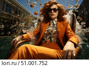 A stylish young woman in a bright orange suit sits in a chair by the pool. Her look is complemented by large sunglasses and a shirt with a floral print. Around her is the effect of splashing water and bubbles, like a frozen moment in time. The scene is filled with dynamics, glamour and freshness. An ideal visual for fashion magazines, advertising of clothes, glasses, summer holidays, as well as topics related to female confidence and style. Стоковое AI-изображение, AI-художник Анна Кривицкая / Фотобанк Лори