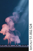 Pink and blue smoke rising from piano keys. Стоковое AI-видео, аниматор Юрий Поздников / Фотобанк Лори