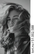 Beautiful model posing with windswept hair in black and white. Стоковое AI-видео, аниматор Юрий Поздников / Фотобанк Лори