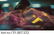 Engaging student reading in a dimly lit library during evening study session. Стоковое AI-видео, аниматор Сергей Толмачёв / Фотобанк Лори