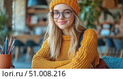 A cheerful young woman studies in a warm café setting, surrounded by art supplies and natural light, embracing a creative atmosphere. Стоковое AI-видео, аниматор Данила Большаков / Фотобанк Лори