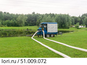 Flood in the park during rains, pump pumps out water. Стоковое фото, фотограф Евгений Харитонов / Фотобанк Лори
