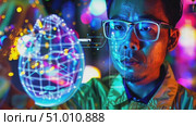 A researcher interacts with glowing holograms, showcasing advancements in digital technology and innovation at a recent technology exhibition. Стоковое AI-видео, аниматор Данила Большаков / Фотобанк Лори